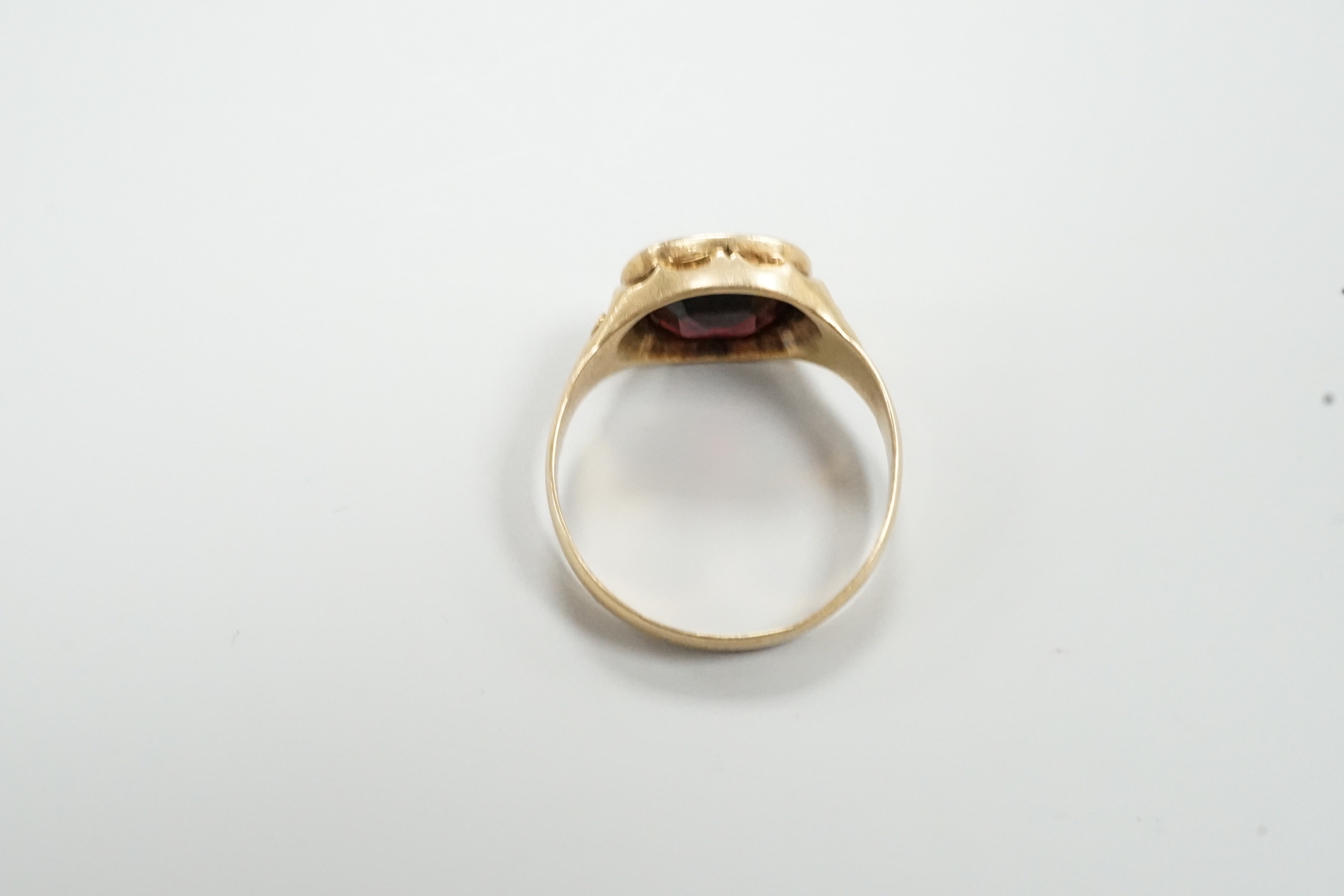 An early 20th century Austro-Hungarian? yellow metal and garnet set ring, size P/Q, gross weight 3.9 grams.
